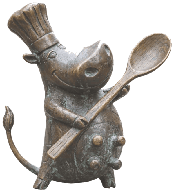 Krówka kucharka — figurka z brązu